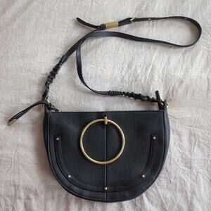 Foley & Corinna Black Pebbled Vegan Leather Crescent Shaped Bag with Brass Ring